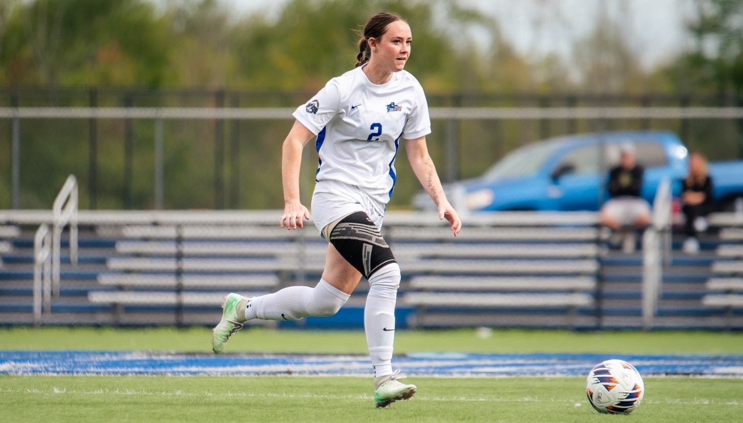 SUNY POLY womens soccer player surveys the field 
