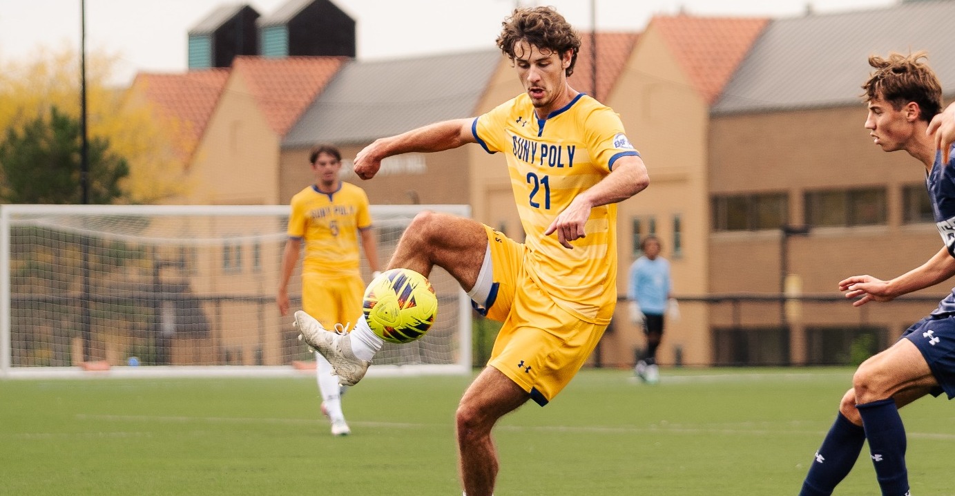 SUNY POLY mens soccer player makes attempt to settle the ball