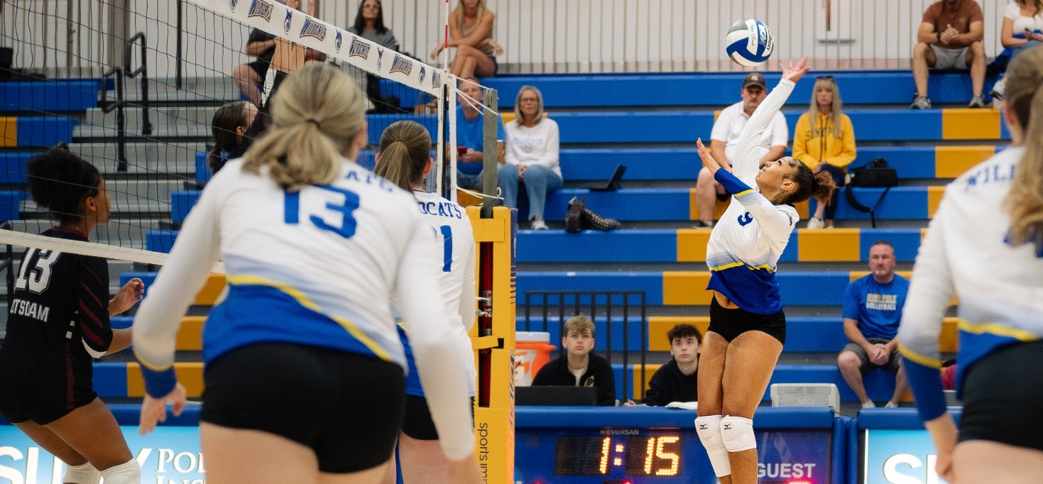 SUNY POLY women's volleyball player jumps for the attack