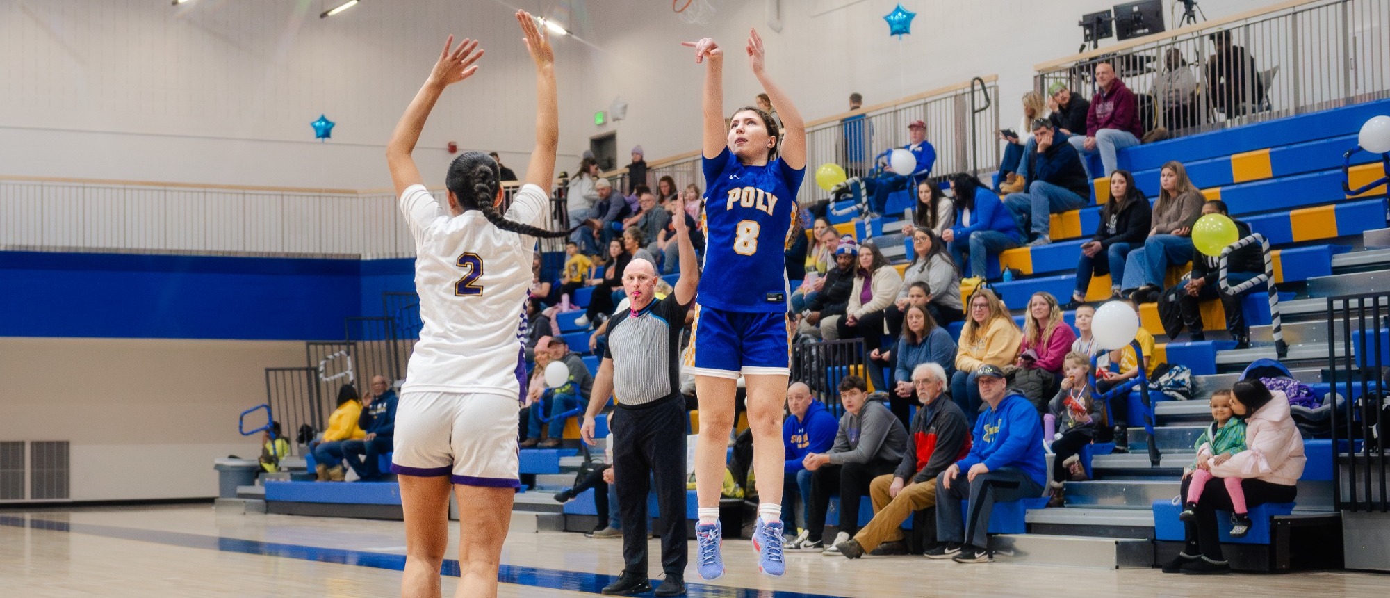SUNY Poly women's basketball player follows through on her three point jump shot