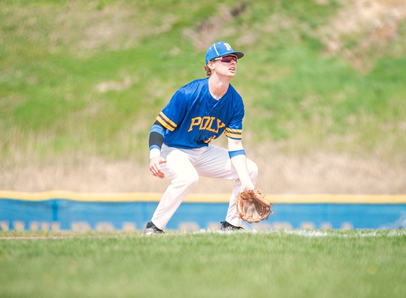 SUNY POLY baseball player gets in defensive stance before pitch is thrown