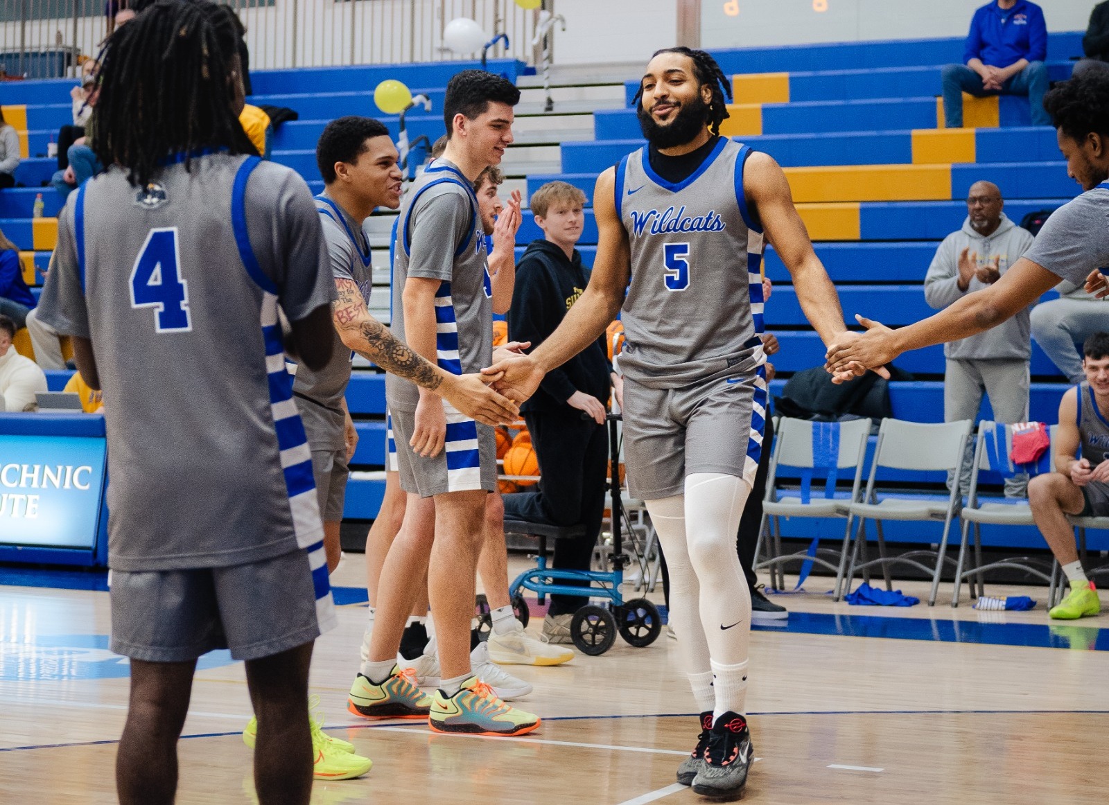 SUNY POLY mens basketball player is introduced during starting lineups