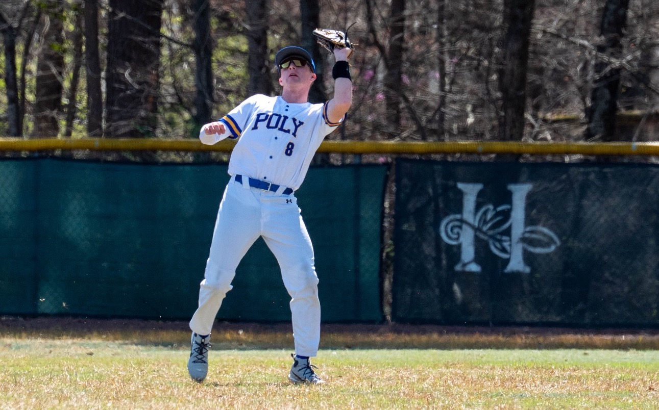 SUNY Poly baseball outfielder positi vs ons himself under incoming fly ball