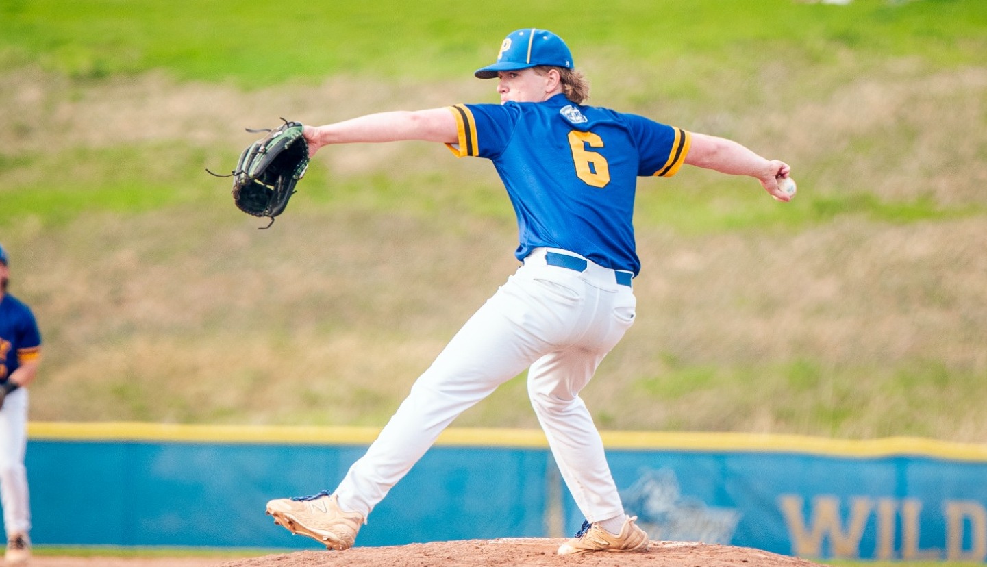 SUNY POLY Pitcher winds up for incoming pitch