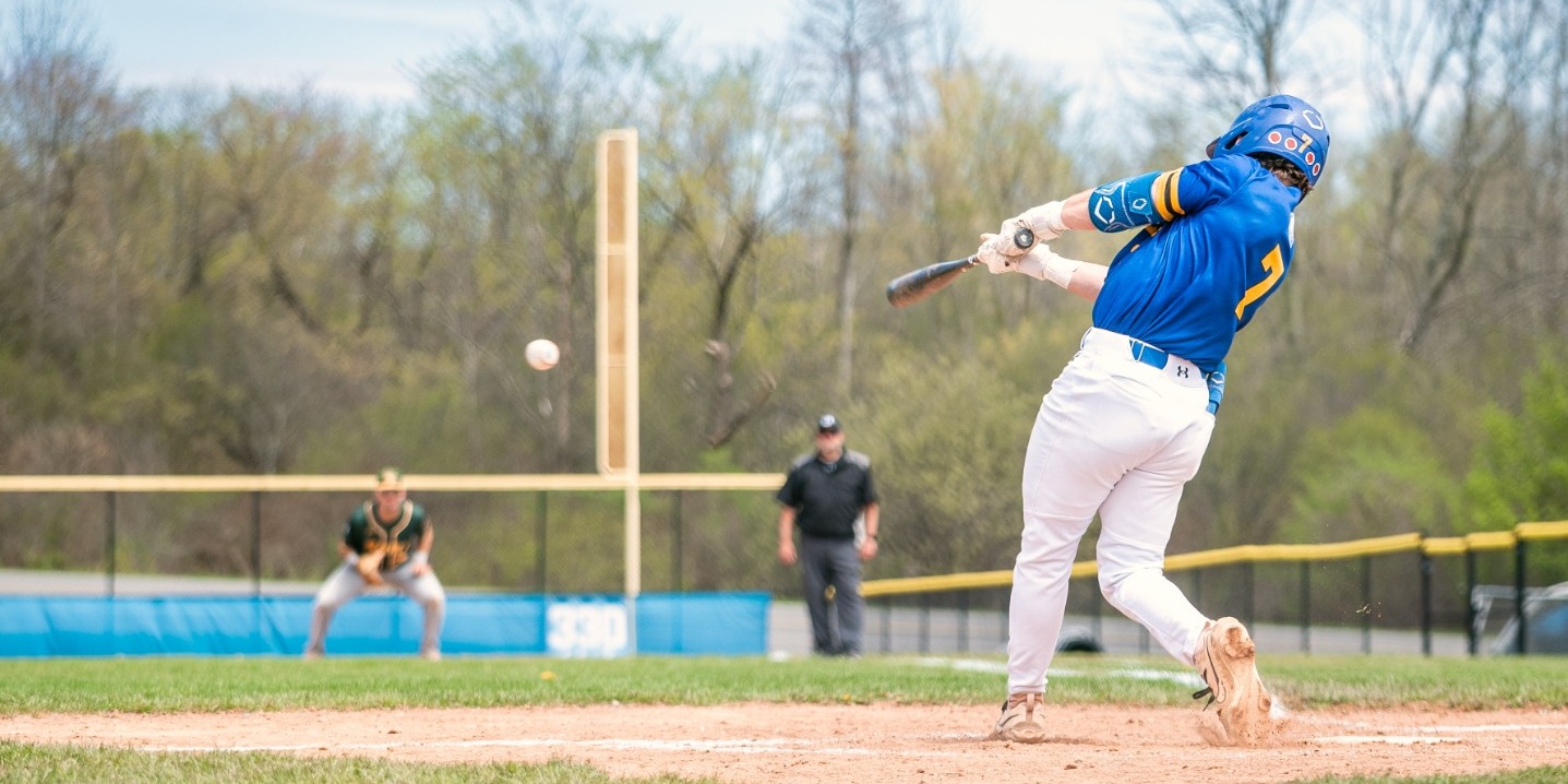 SUNY POLY Baseball player makes contact with incoming pitch