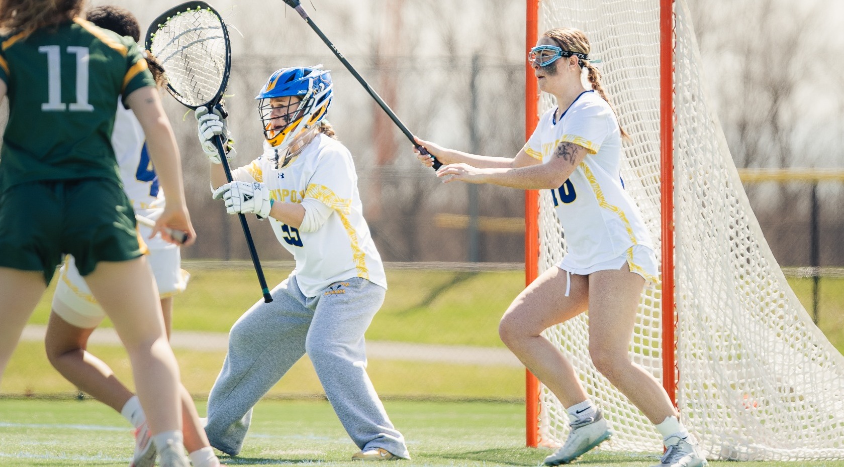 SUNY Poly women's lacrosse players defend their goal
