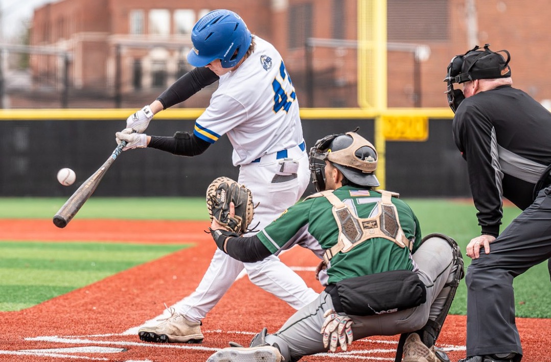SUNY Poly baseball player takes a swing at the incoming pitch