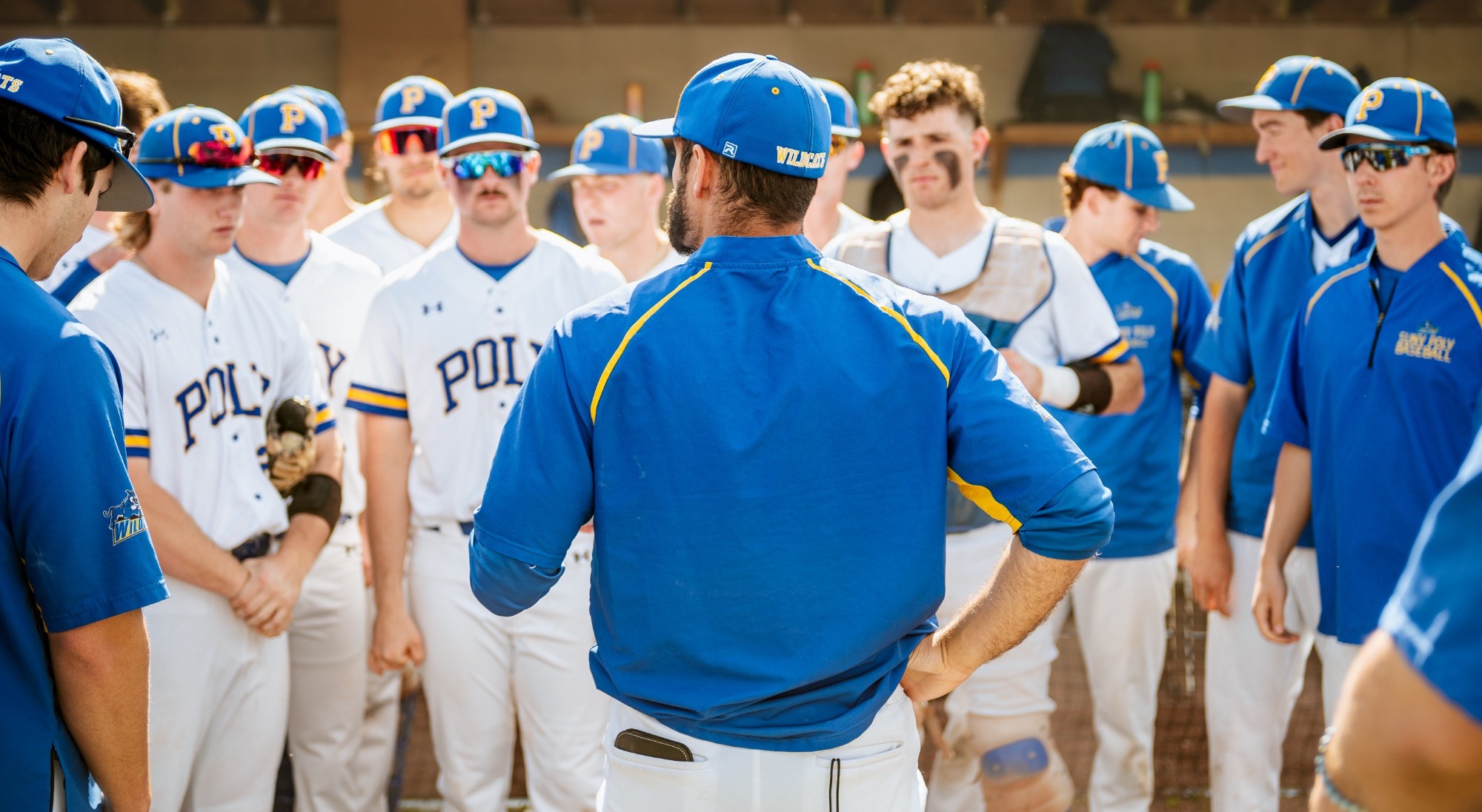 Wildcat baseball coach gathers the team ahead of important conference playoff game