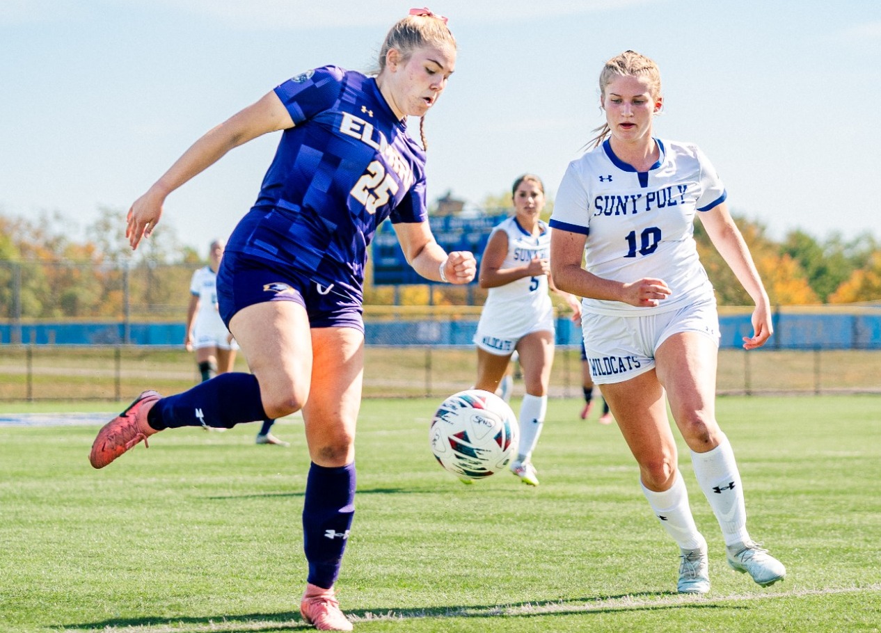 SUNY Poly women's soccer players makes a move for the ball against opposing player
