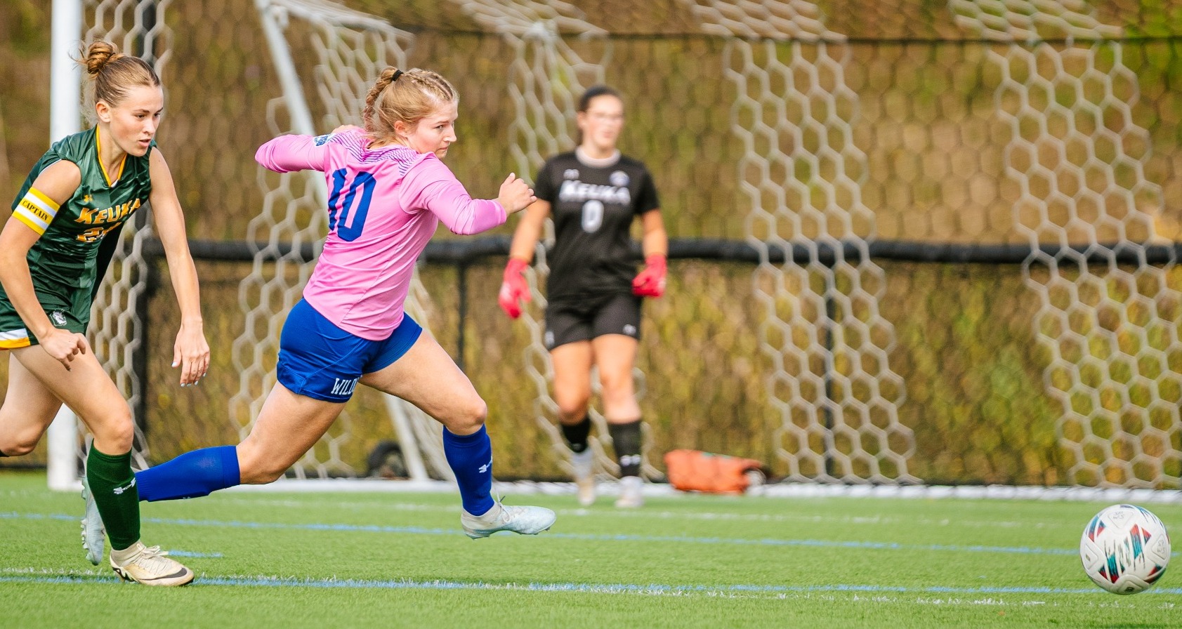 SUNY POLY women's soccer player makes a break on the ball