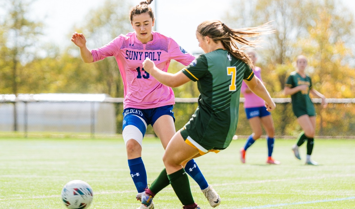 SUNY POLY women's soccer player makes a move on opposing defender