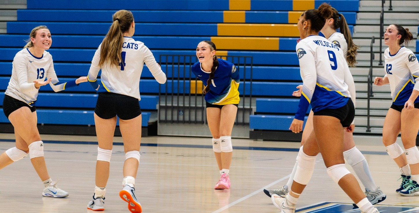 SUNY POLY Women's volleyball team celebrates after earning point