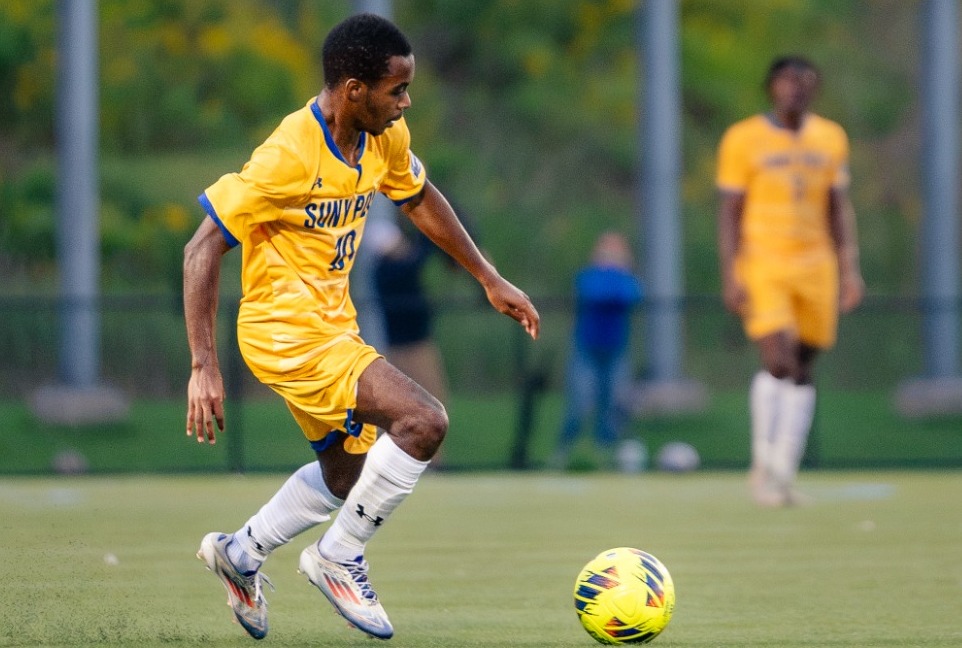 SUNY Poly men's soccer players work the ball up the field