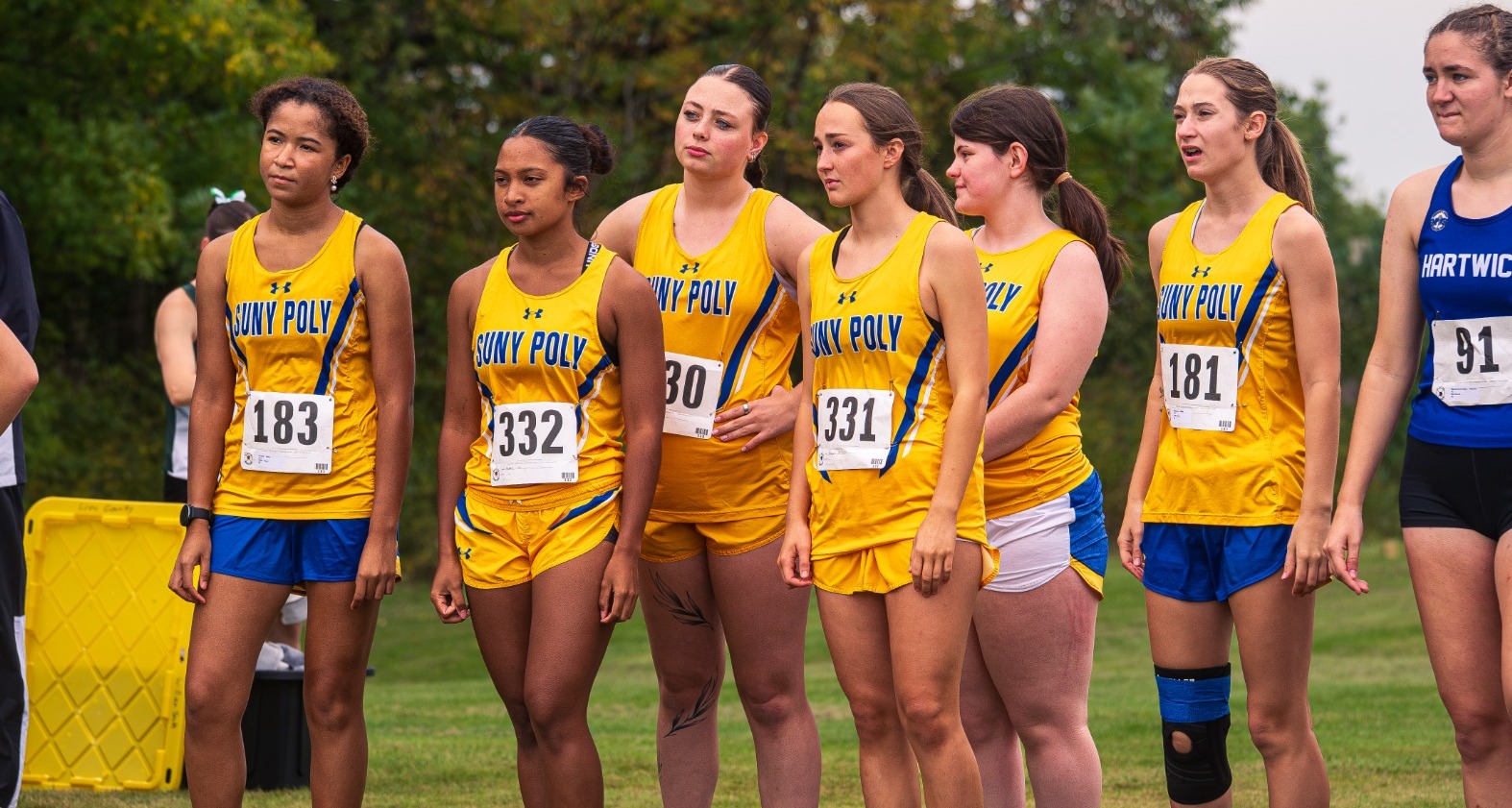 SUNY POLY women's cross country team lines up for the start of the 