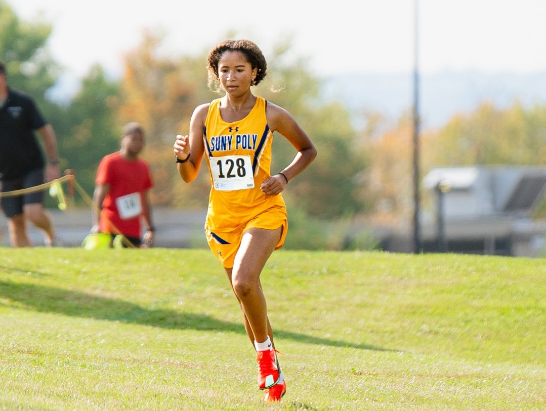 SUNY Poly women's cross country runner finishes her run on the Short Course Invitational