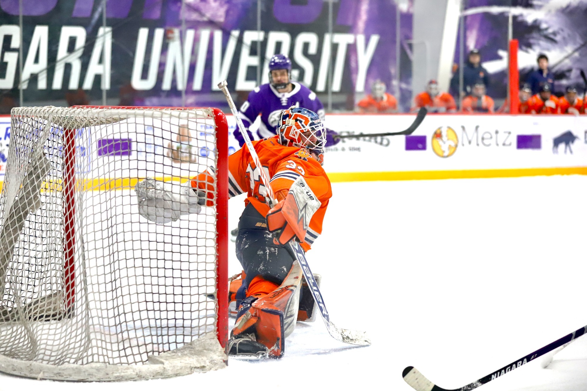 John Angelino Making a save against NU