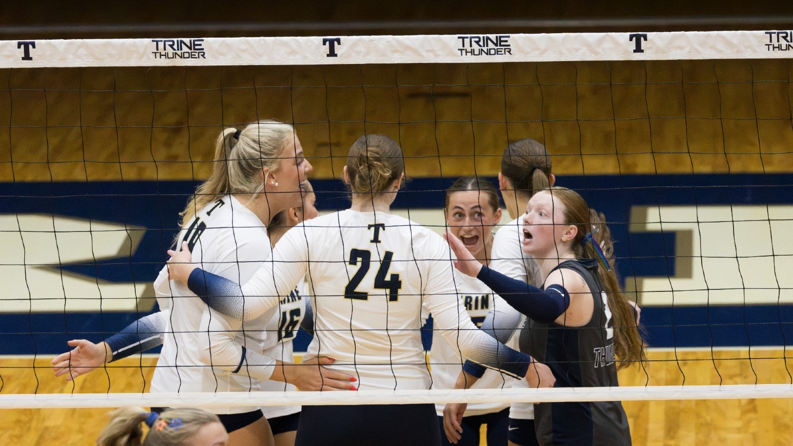The Volleyball team celebrates a point