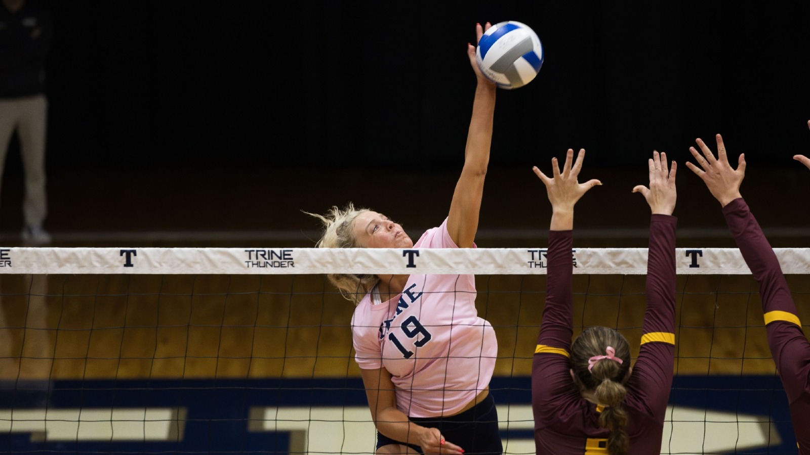 Reese Steenwyk send the ball over the net