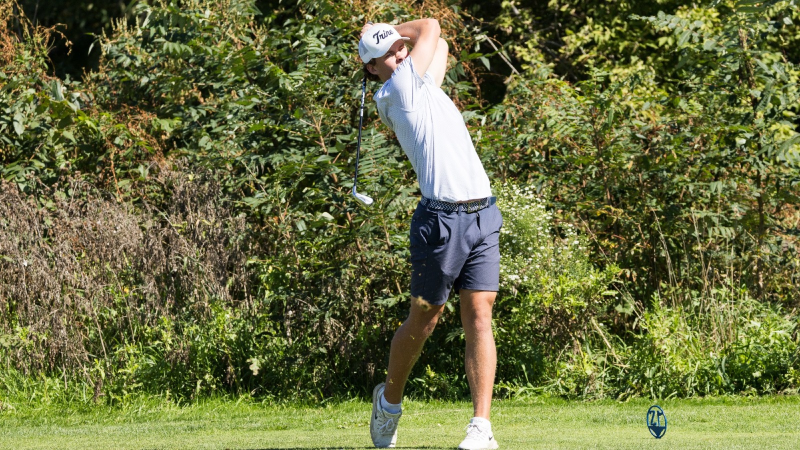 Jake Bilby drives the ball into the fairway