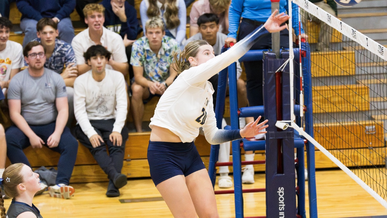 Elli Baker sends the ball over the net