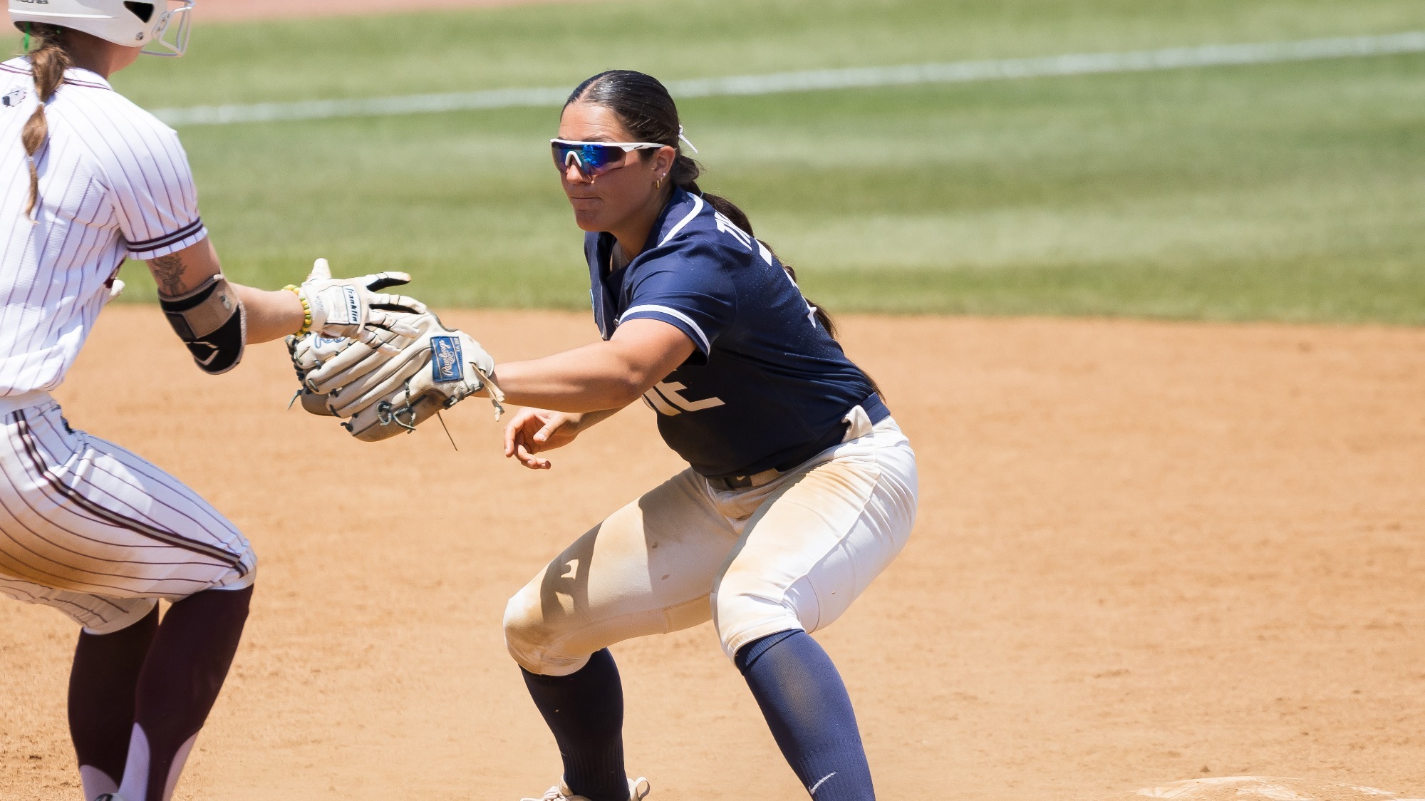 Lee tags out a runner trying to stretch a single to second