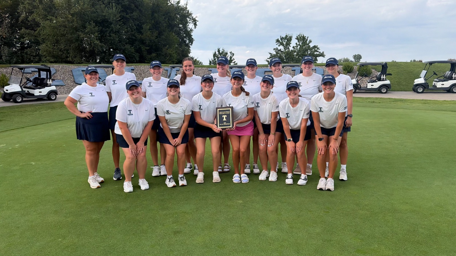 Trine Women's Golf poses with the trophy from the Kickoff Classic