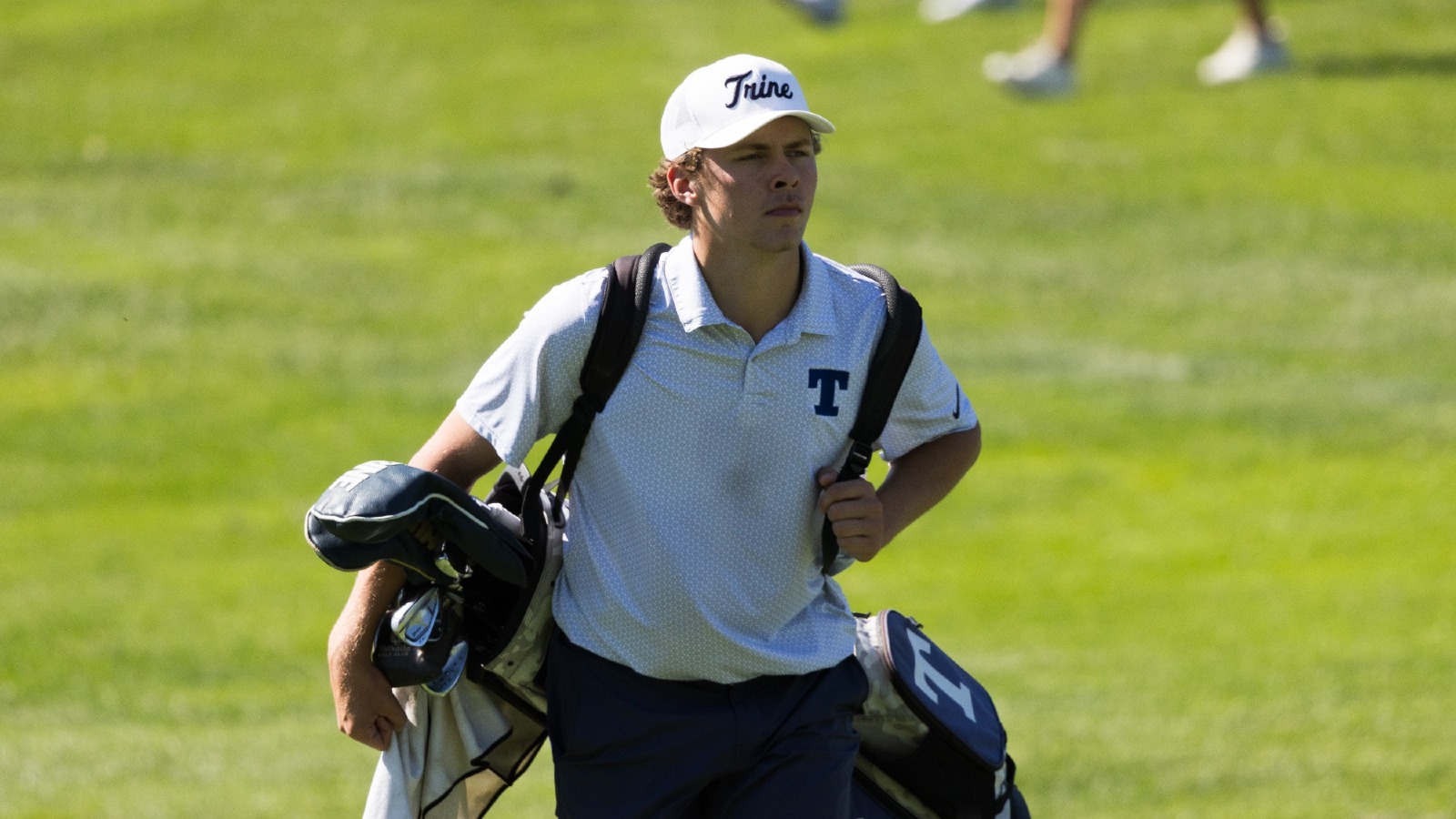 Myles Secor walks up the fairway