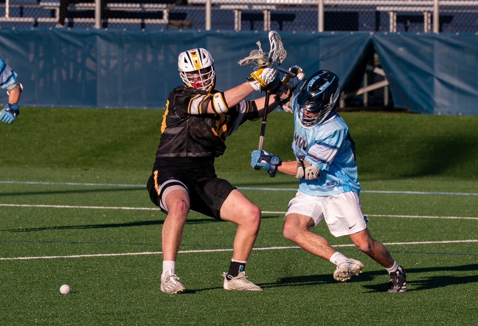 Jacob Fowler fights for a faceoff