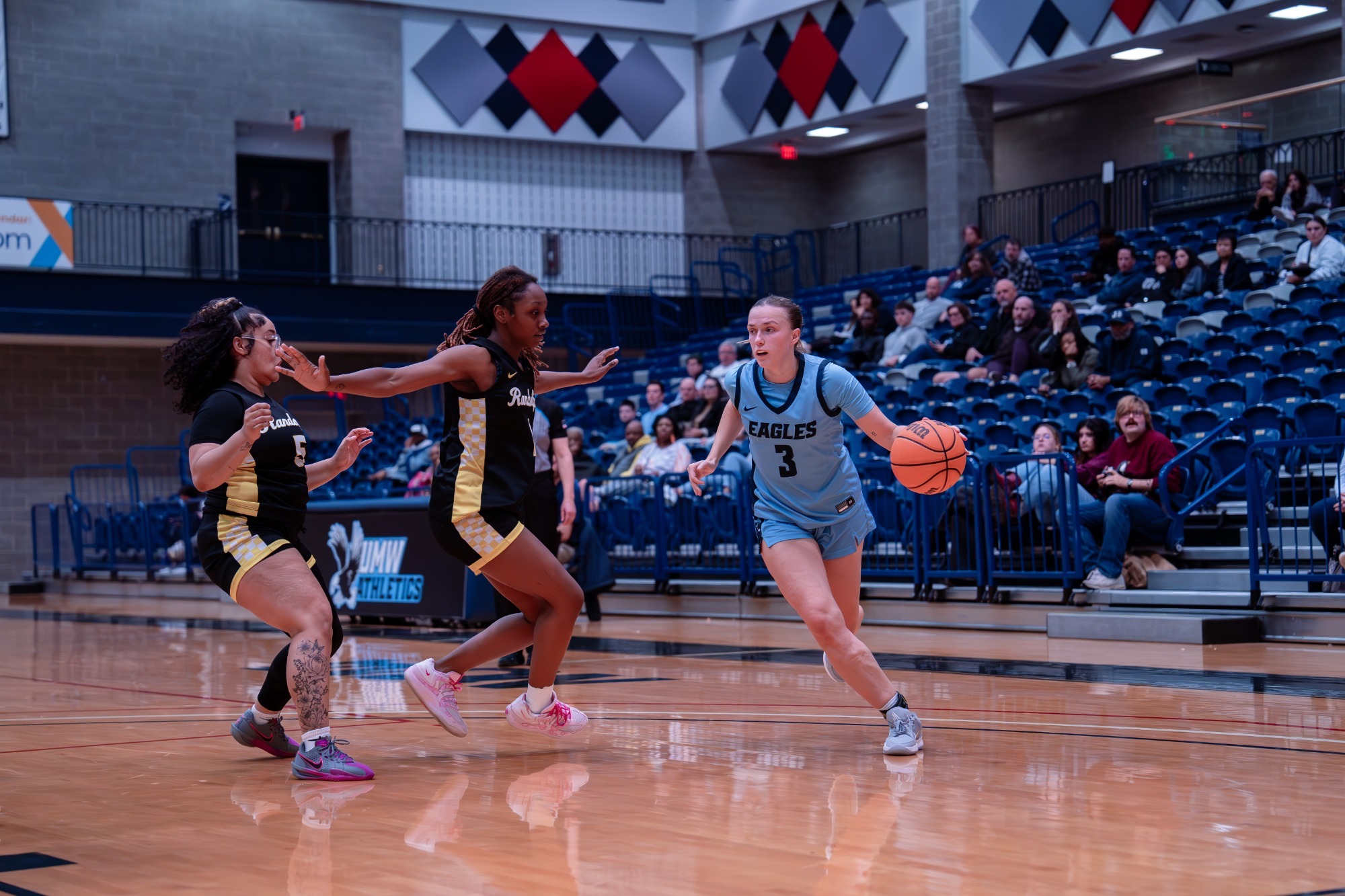 UMW's Jenna Steadman dribbles past a pair of defenders