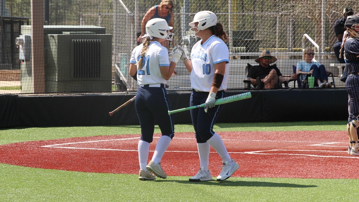 Isabelle Calagaz and Desiree Denmark high-fiving