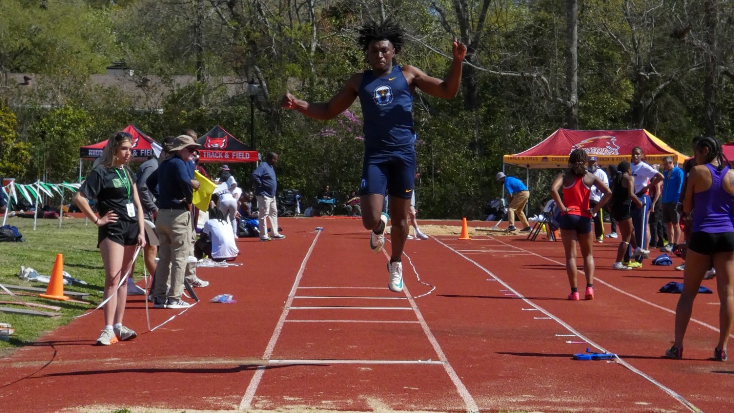 Rod Burnett competing in the triple jump