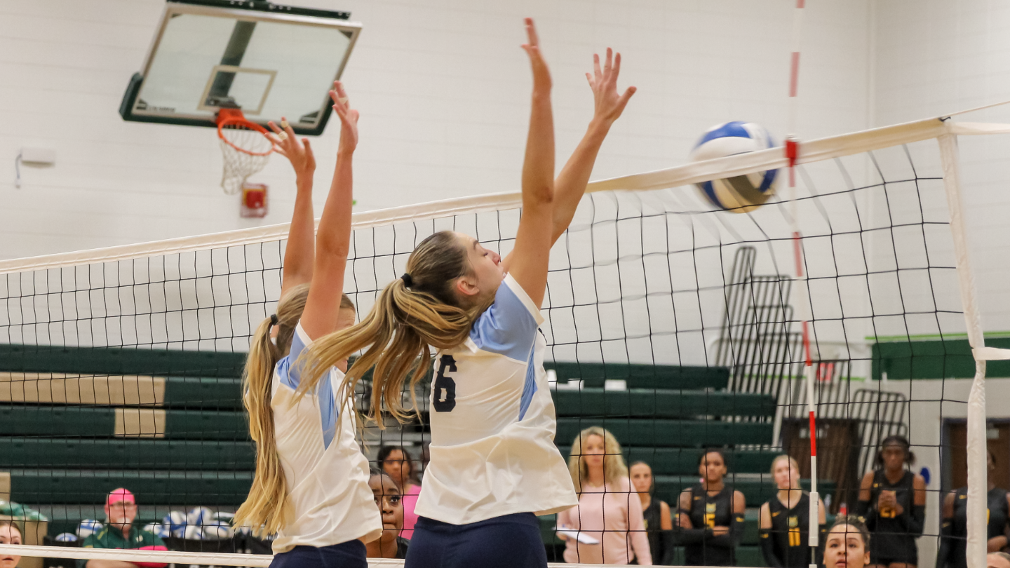 Jeya Dupris blocking a ball at the net