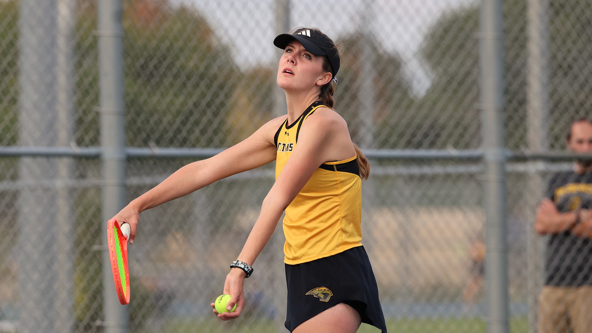 2025 Bre Schultz Action Shot, throwing the ball up to serve against Stout