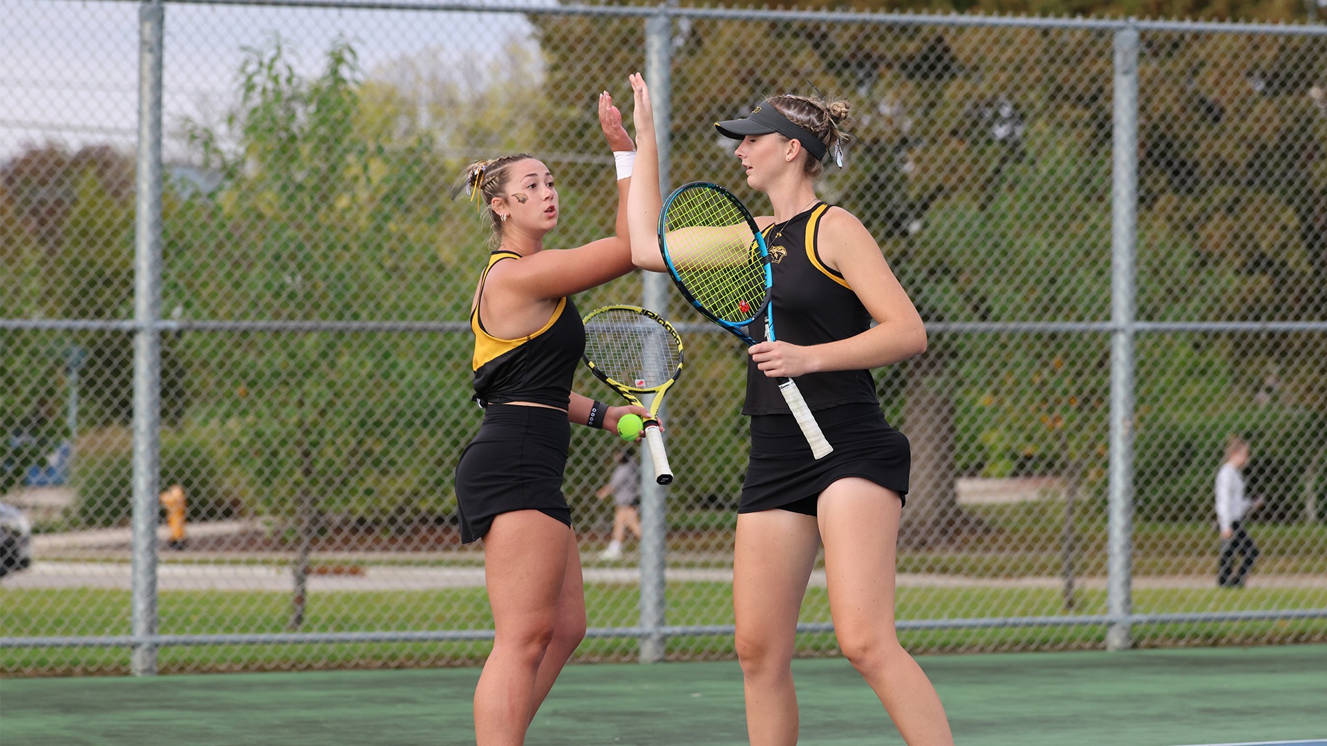 2025 Jameson Gregory and Kayla Gibbs Action Shot, high fiving after winning a point against Stout