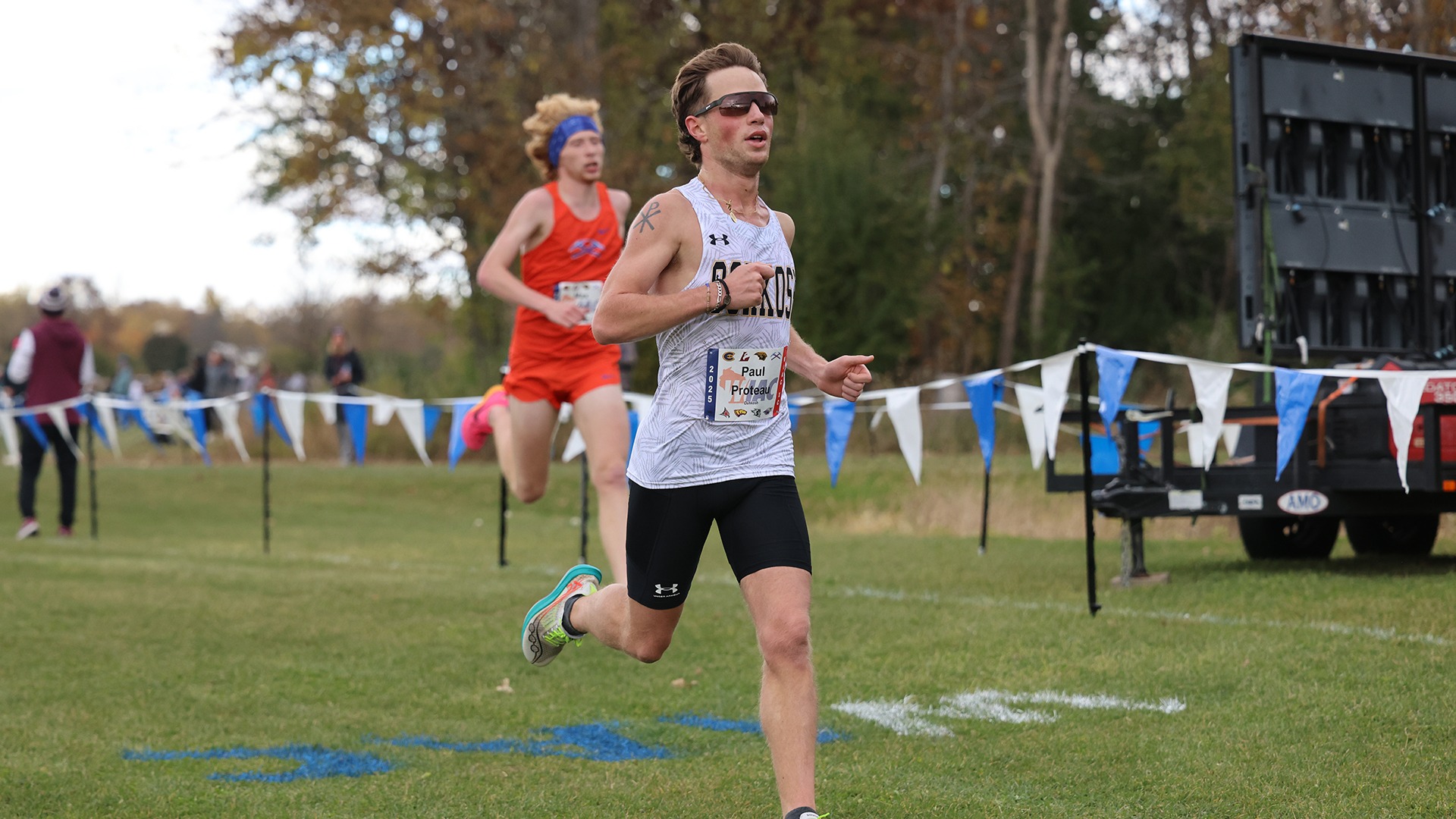 2025 Paul Proteau Action Shot, crossing the finish line at the WIAC Championship