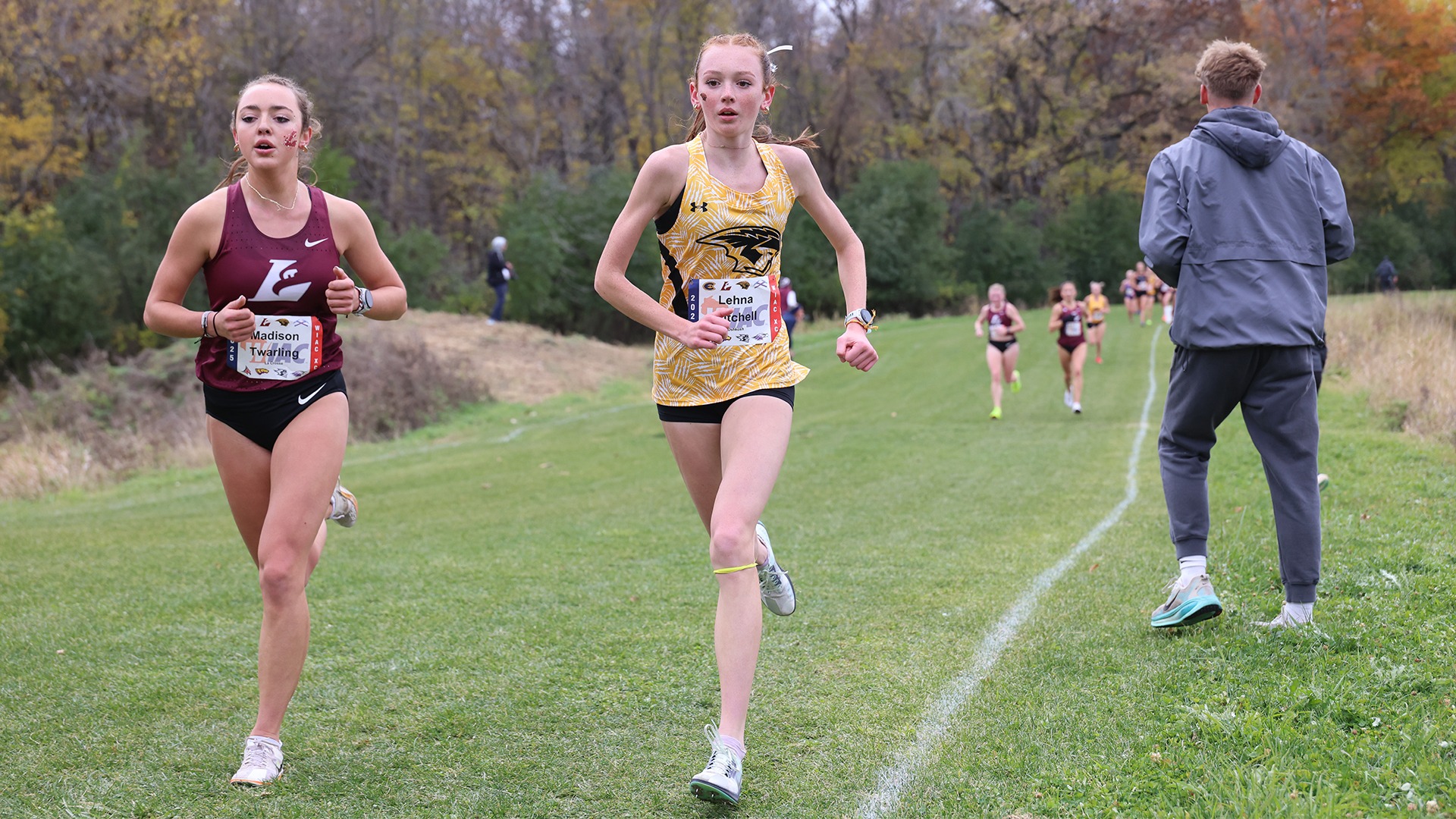 2025 Lehna Mitchell Action Shot, running at the WIAC Championship