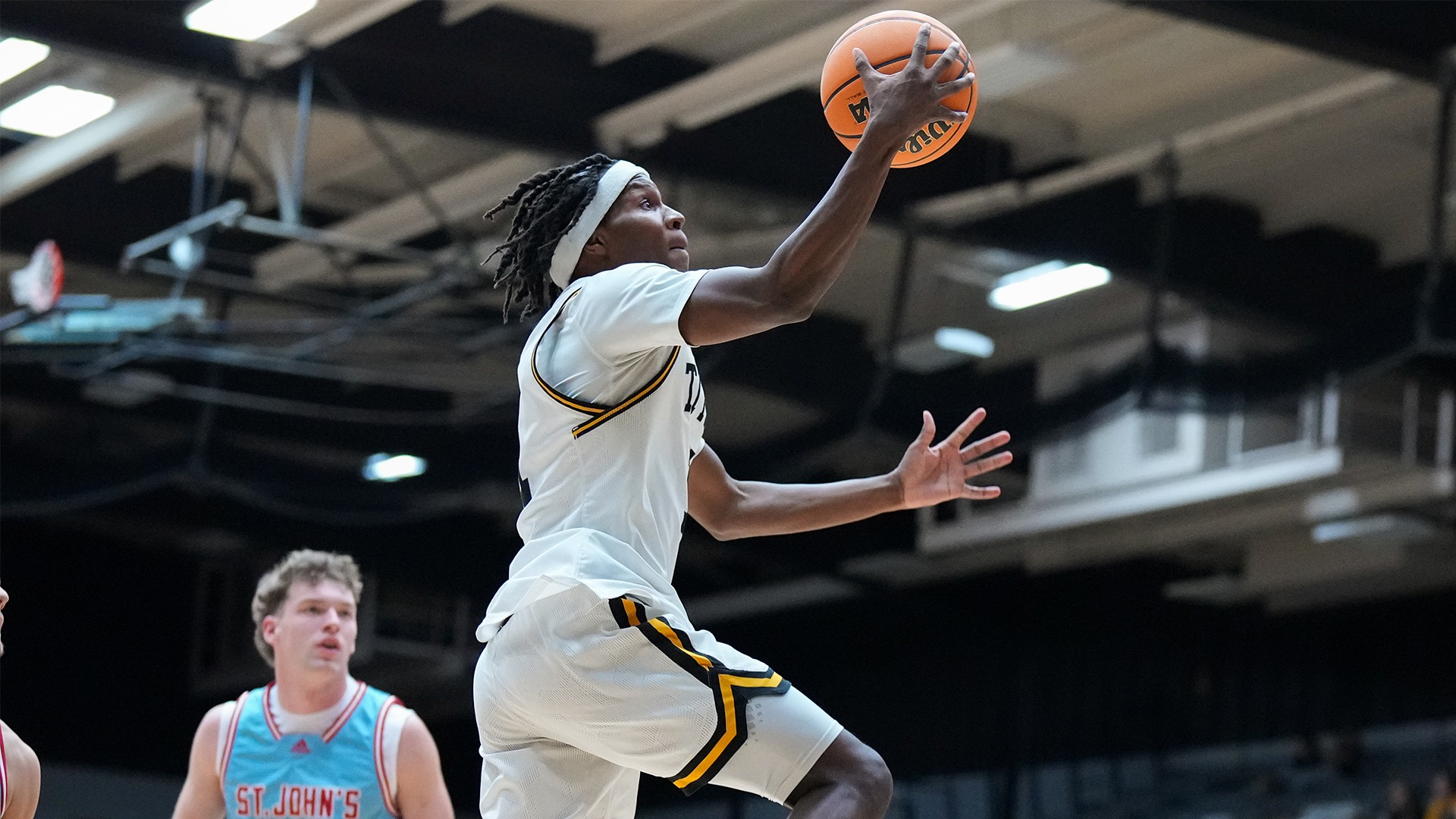 2025 Jay Dalton Action Shot, going up for a layup against Saint John's