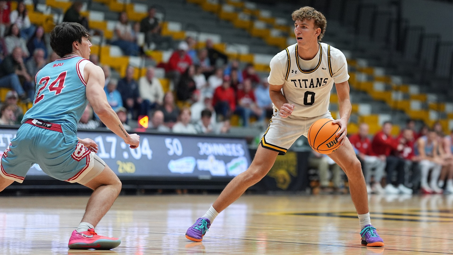 2025 Brandon Beck Action Shot, dribbling the ball against a Saint John's defender