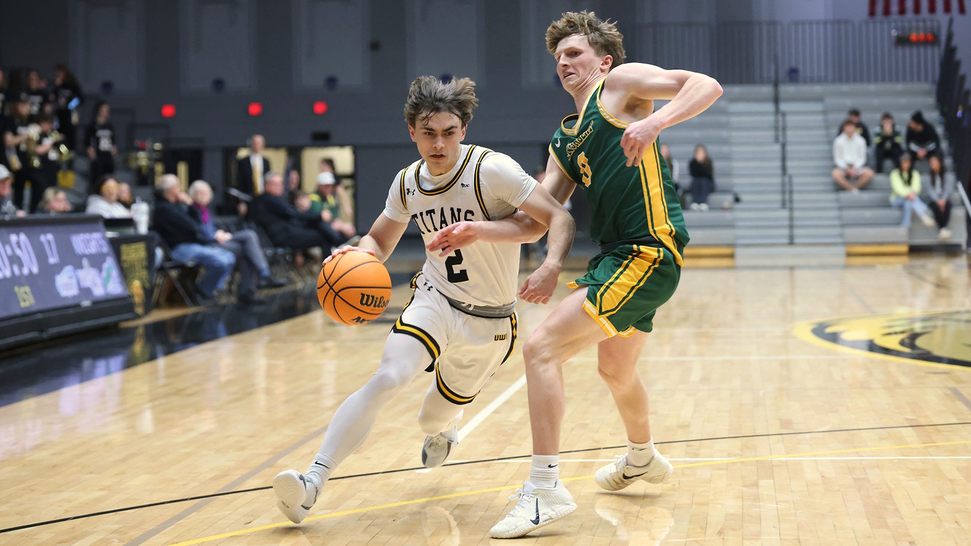 2025 Joey LaChapell Action Shot, driving past a St. Norbert defender