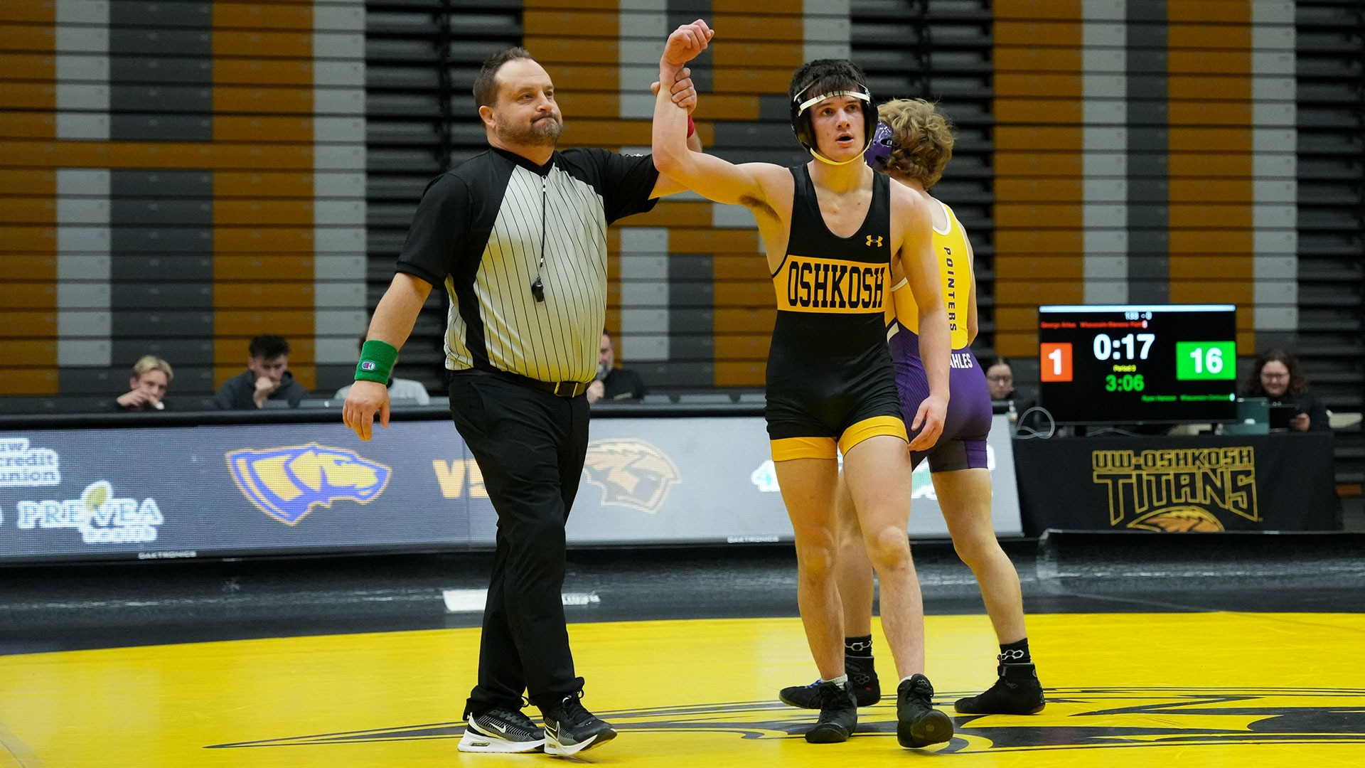 2025 Ryan Hanson Action Shot, holding up his hand after defeating his Stevens Point opponent