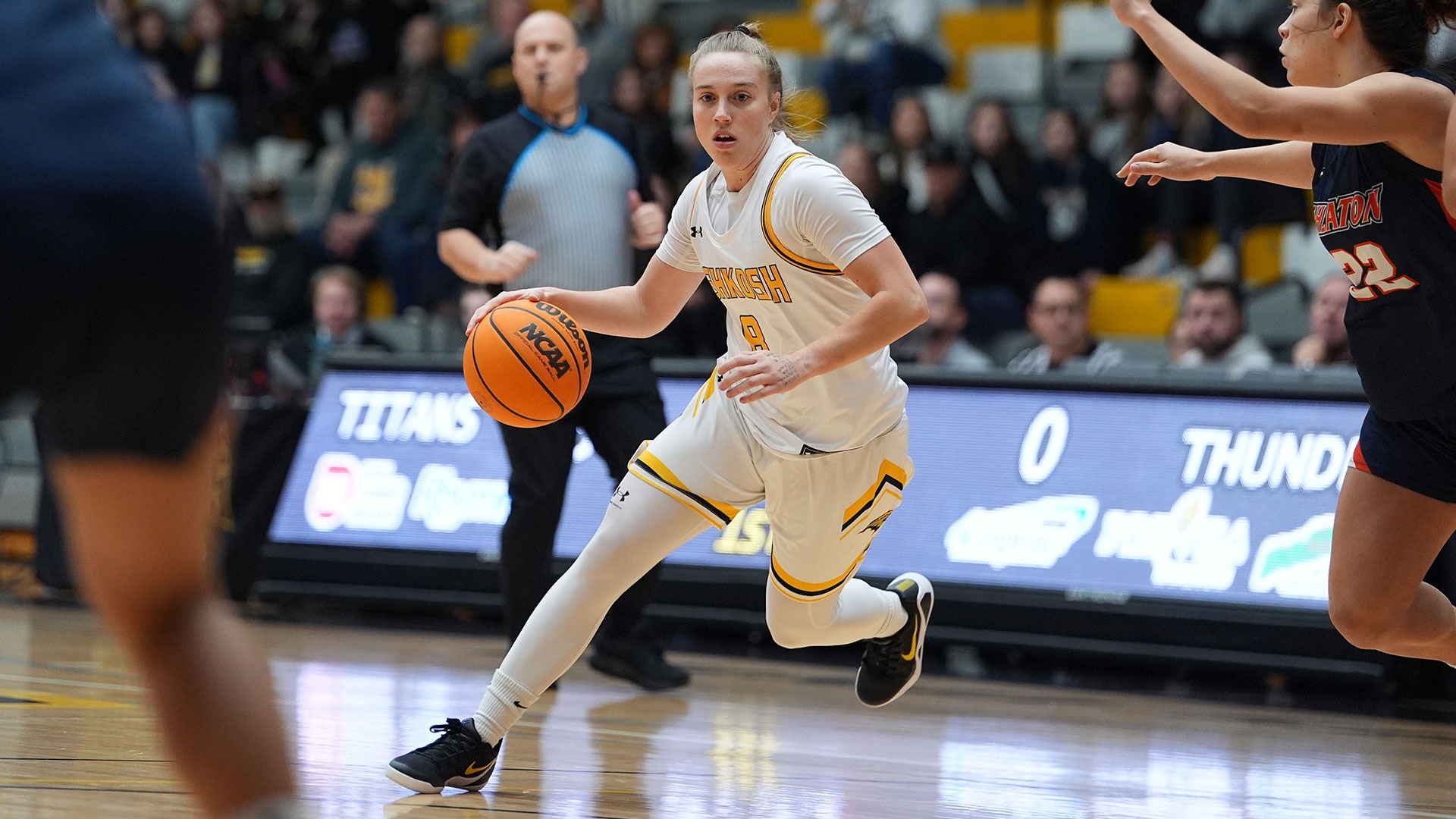 2025 Sammi Beyer Action Shot, dribbling between Wheaton defenders