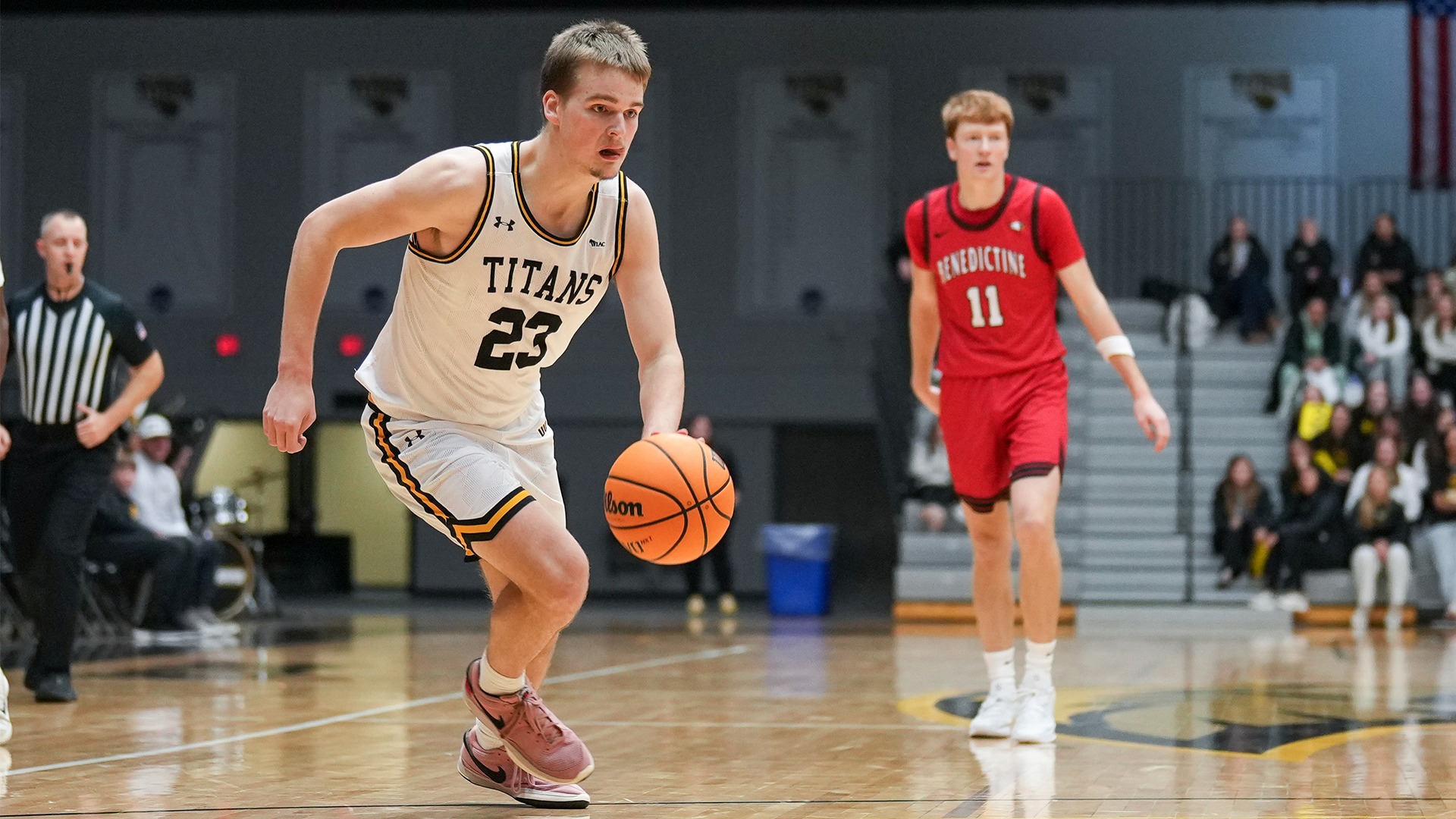 2025-26 Oskar Kangas Action Shot, driving down-court against Benedictine