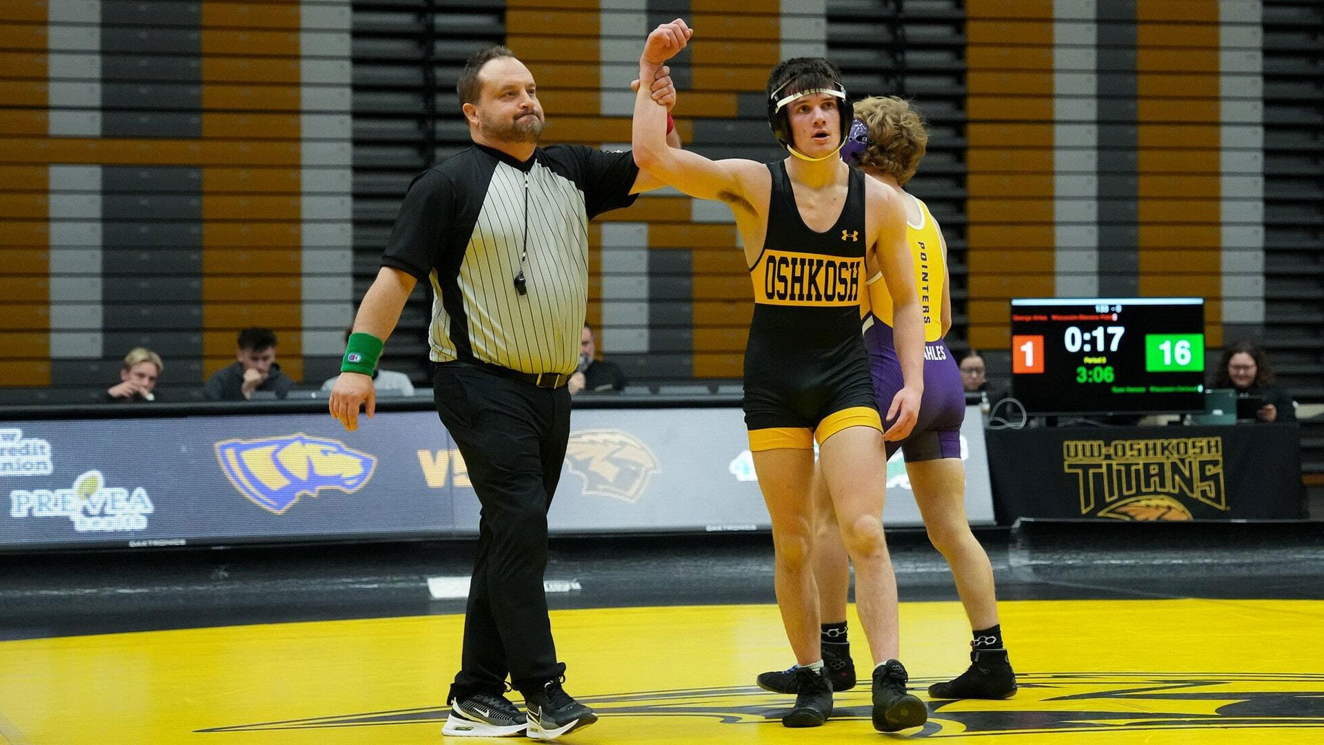 2025 Ryan Hanson Action Shot, holding his hand up after beating his Stevens Point opponent