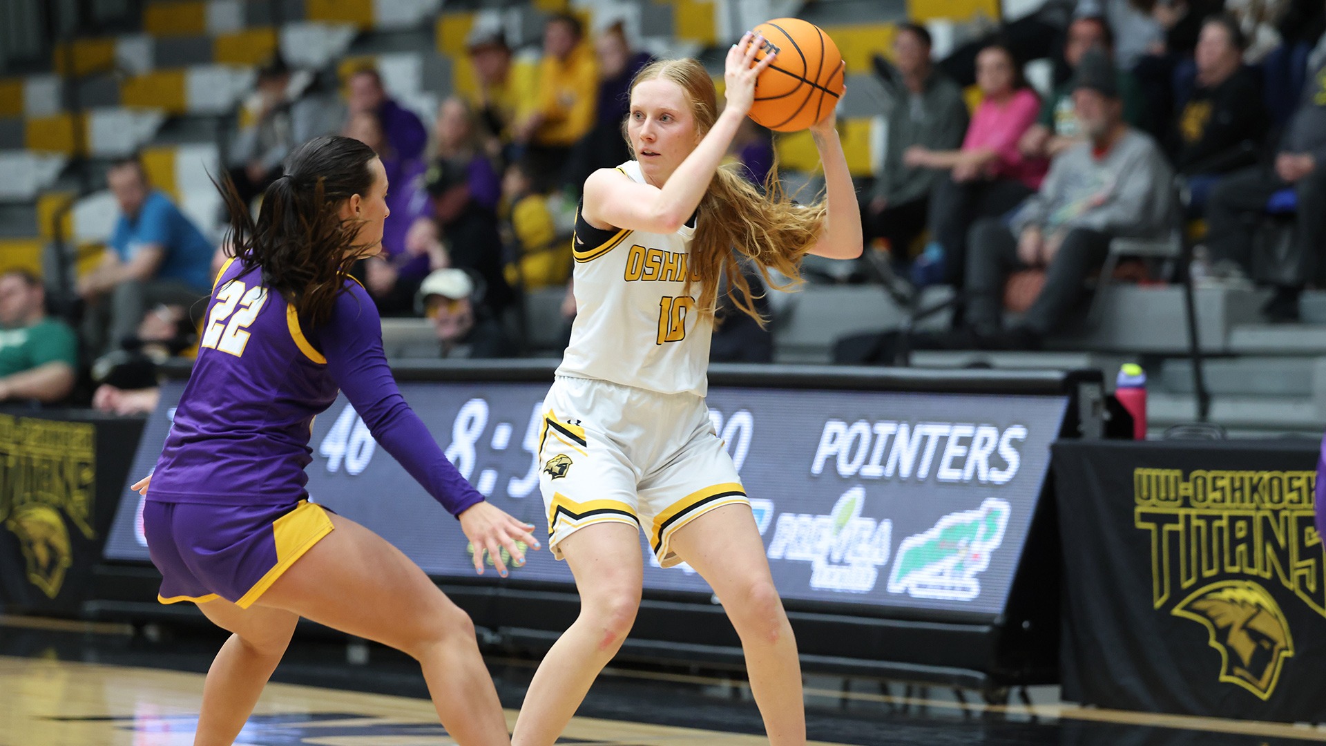 2026 Olivia Argall Action Shot, holding the ball against Stevens Point