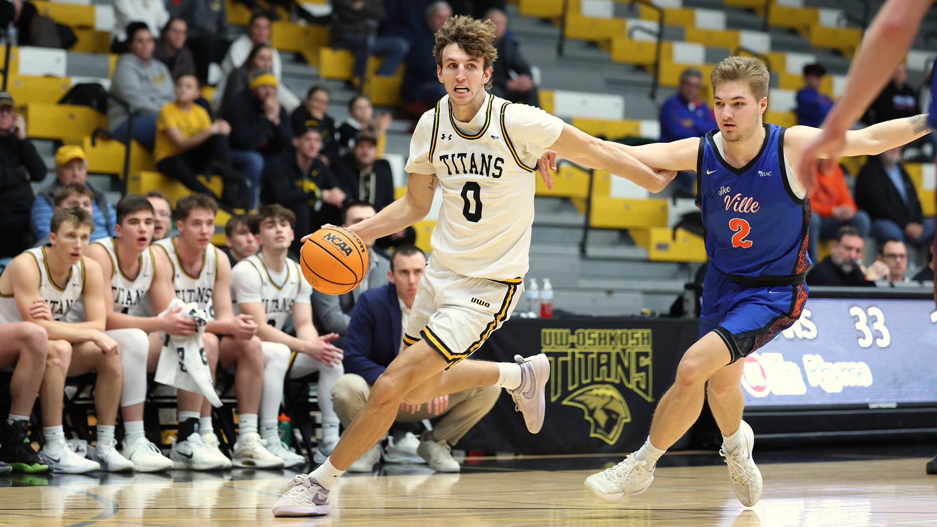 2026 Brandon Beck Action Shot, dribbling towards the basket against Platteville