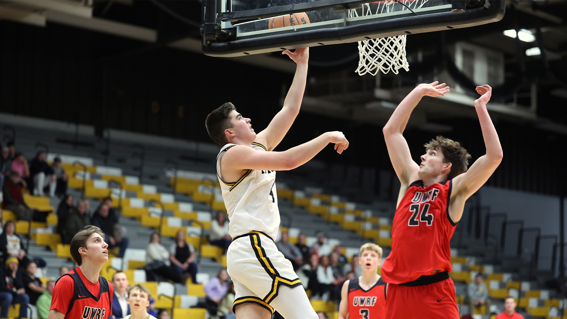 2026 Michael Metcalf-Grassman Action Shot, going up for a layup against River Falls