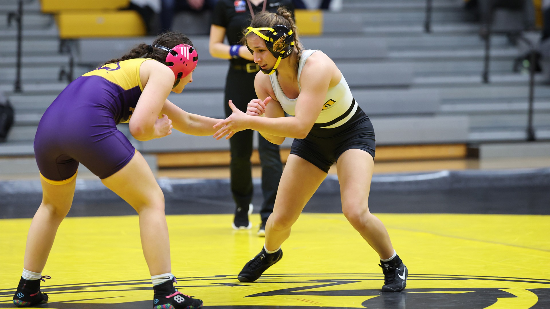 2026 Aliana Rauter Action Shot, grappling with her Stevens Point opponent