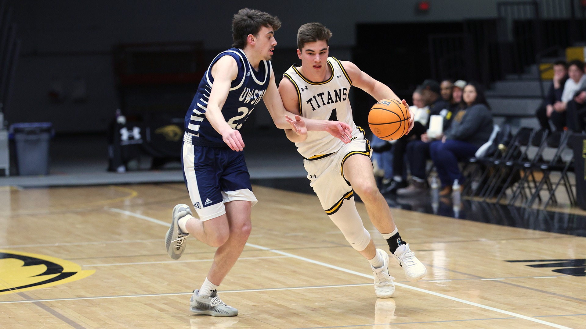 2026 Michael Metcalf-Grassman Action Shot, dribbling against Stout defender