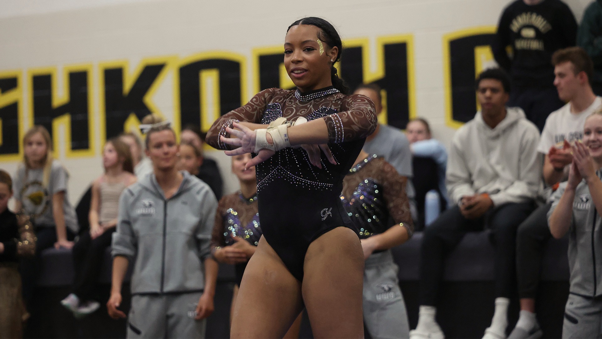 2026 Ome Ellis Action Shot, competing in floor exercise against Whitewater