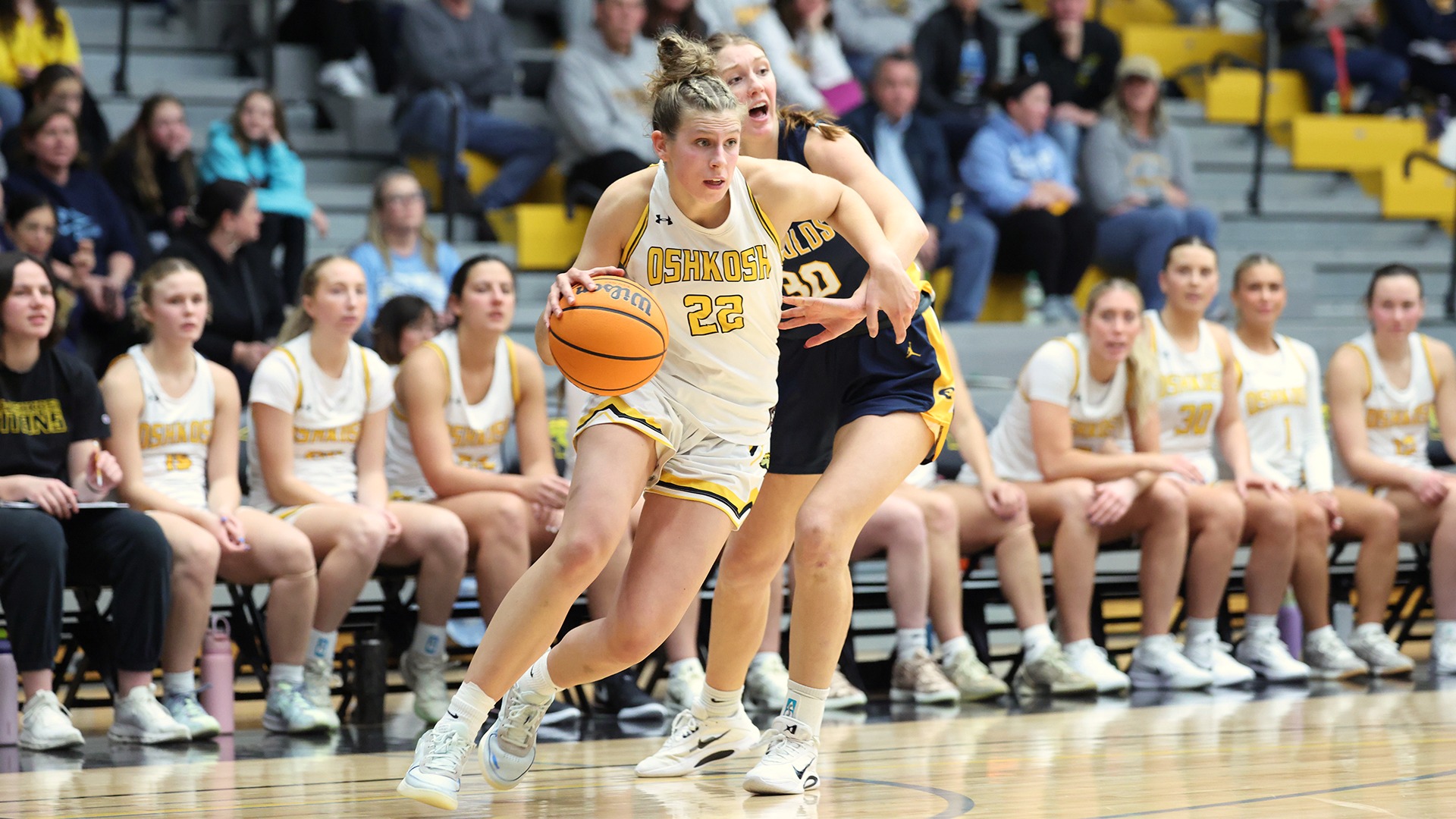 2026 Paige Seckar Action Shot, driving to the basket against Eau Claire